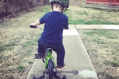 Riding His Bike
